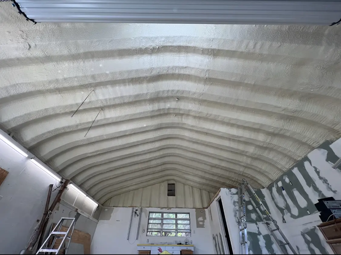 Spray polyurethane foam applied to the underside of a metal roof deck in Haverford